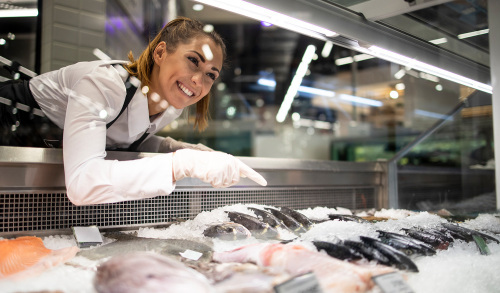 Fresh seafood on ice at retail counter