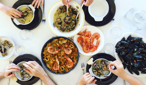 overhead shot of seafood meals on a table